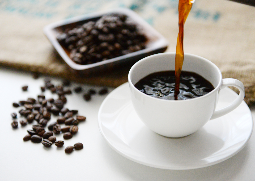 Pouring Brazilian coffee into cup.