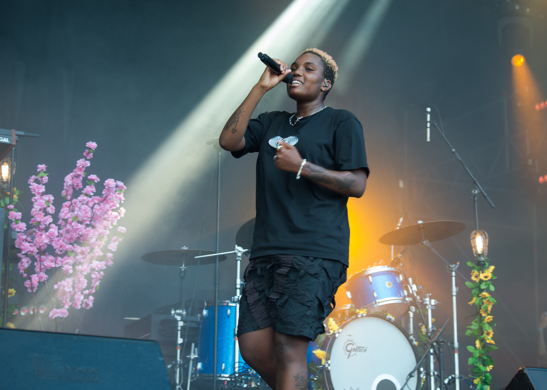 Arlo Parks performing onstage in Paris