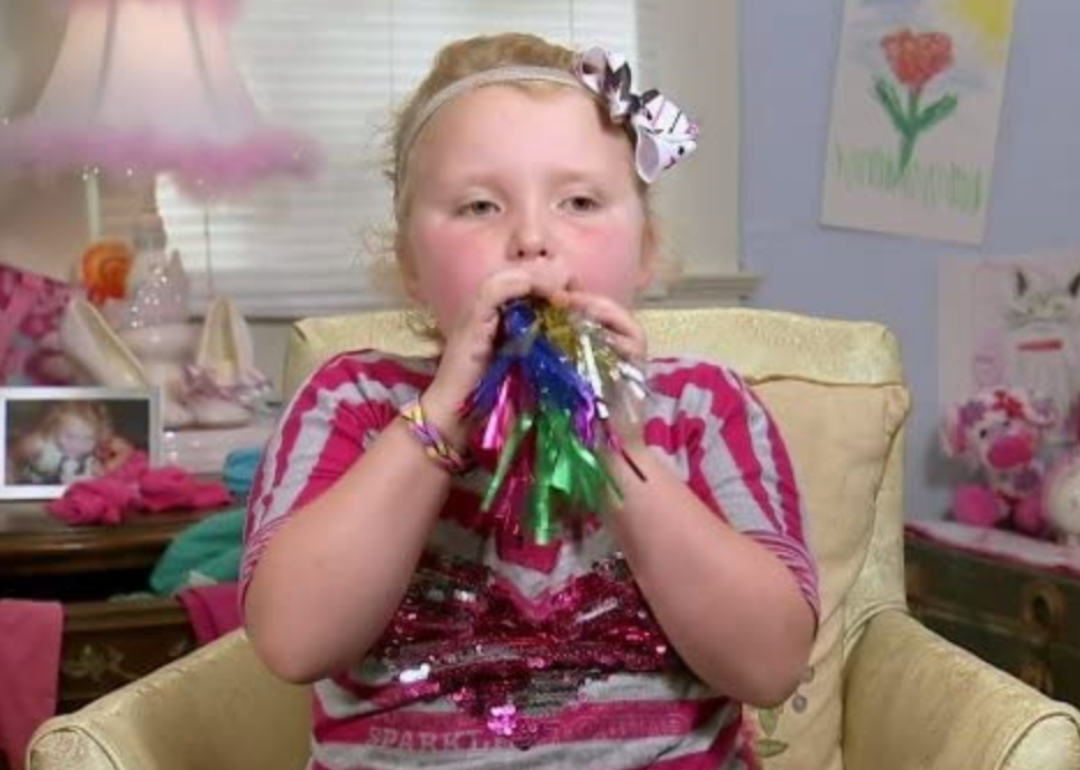 Honey Boo Boo blowing on a party noisemaker