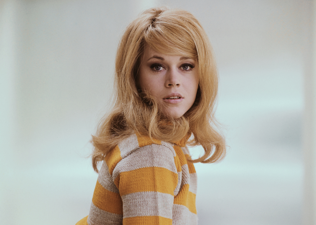 Portrait of actress Jane Fonda in a mustard yellow sweater early in her career.