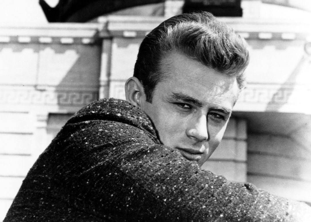 Actor James Dean poses for a Warner Bros. publicity shot for his film 'Rebel Without A Cause' at the Griffith Park Observatory in 1955 in Los Angeles, California.