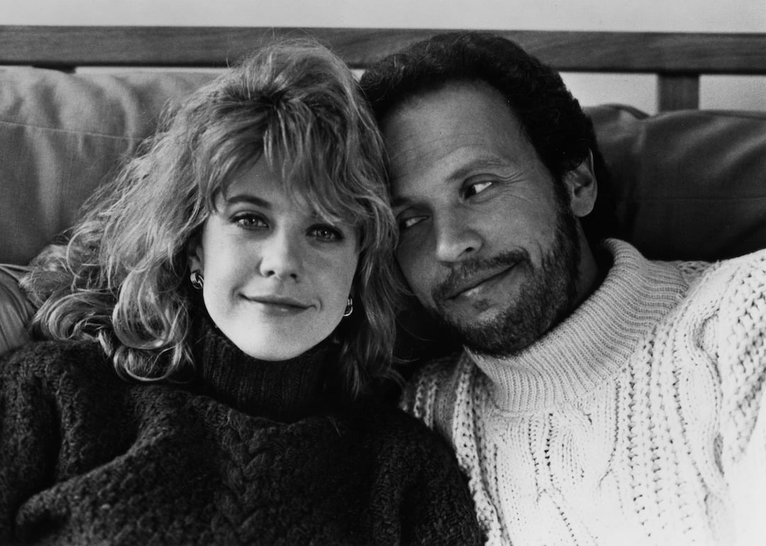 Actors Meg Ryan and Billy Crystal in cable-knit turtleneck sweaters pose for the movie 'When Harry Met Sally' in 1989.
