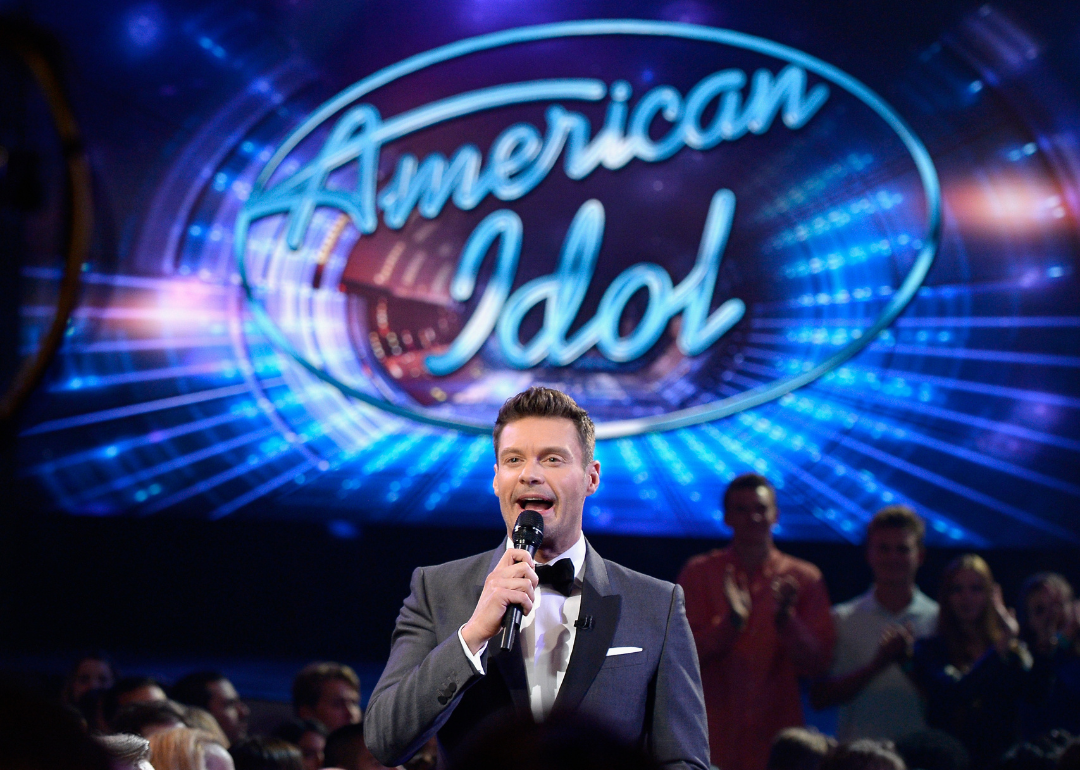 Ryan Seacrest speaks to the audience on the stage of "American Idol"