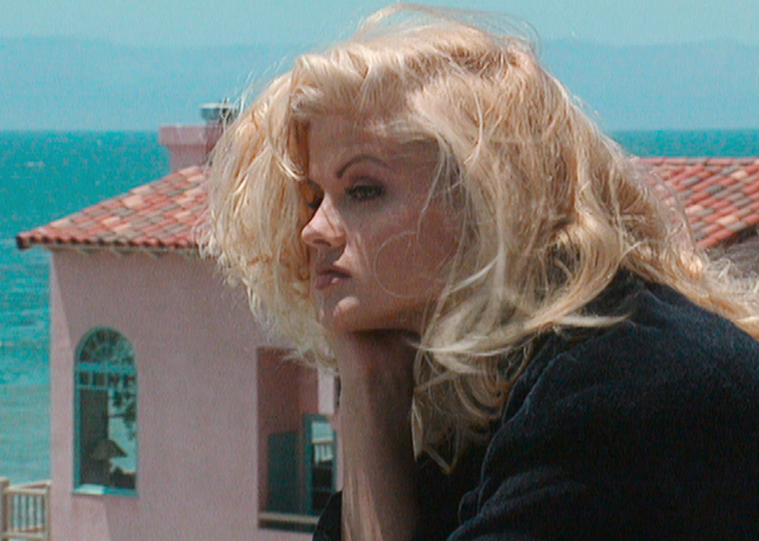 Anna Nicole Smith looks out at the views from a balcony in the Netflix documentary 'Anna Nicole Smith: You Don't Know Me.'