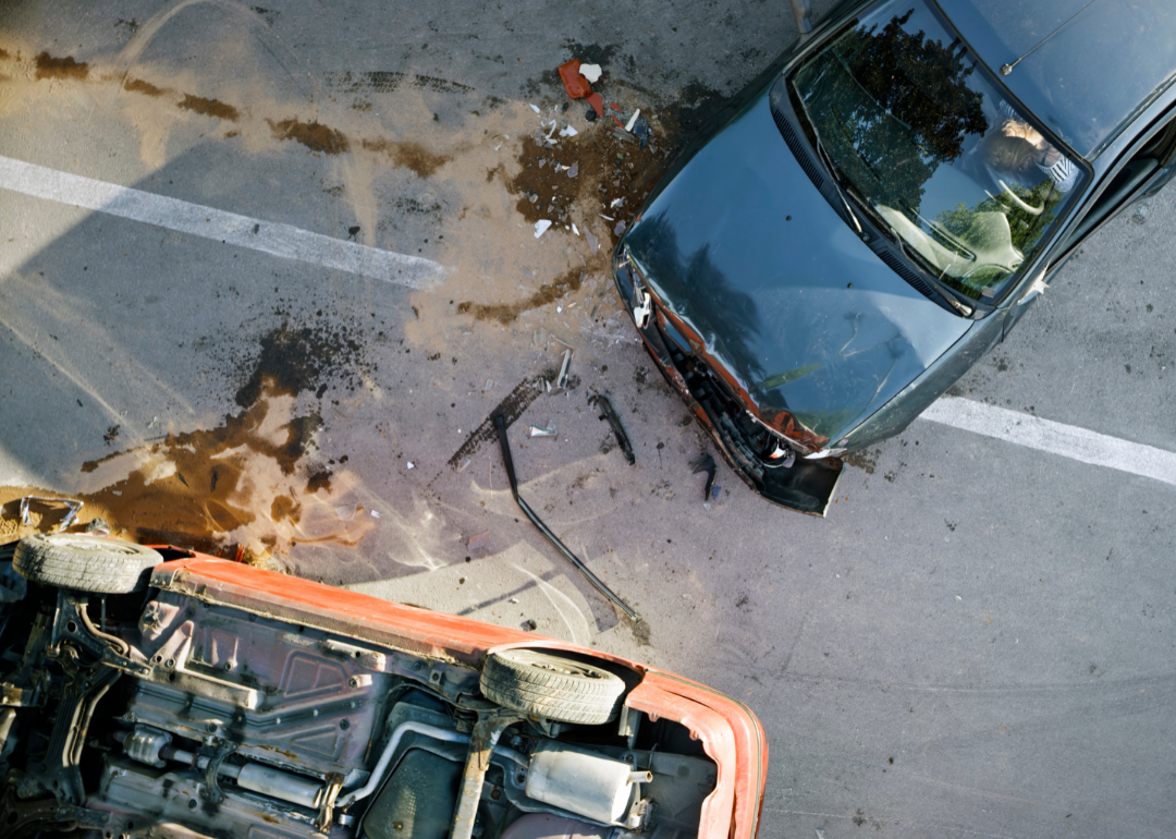 Aerial view of car crash between two damaged vehicle.