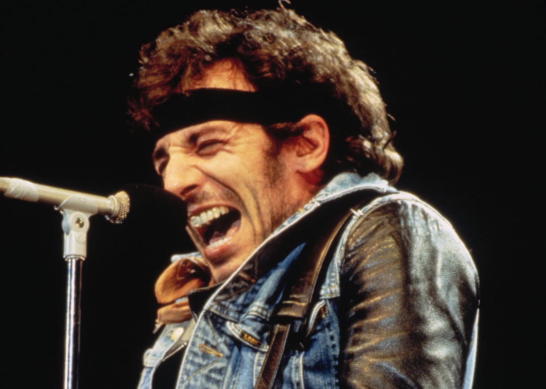 Bruce Springsteen singing on stage in 1985.