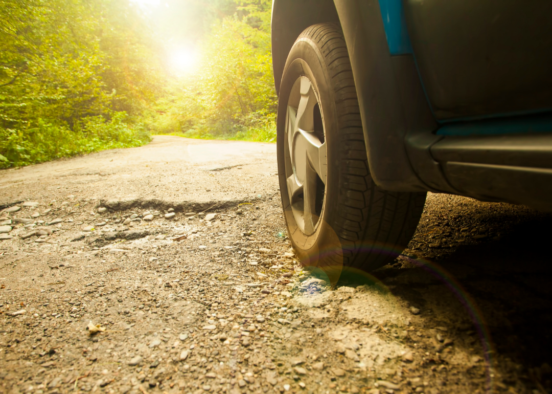 A closeup of car tires on a hot day.