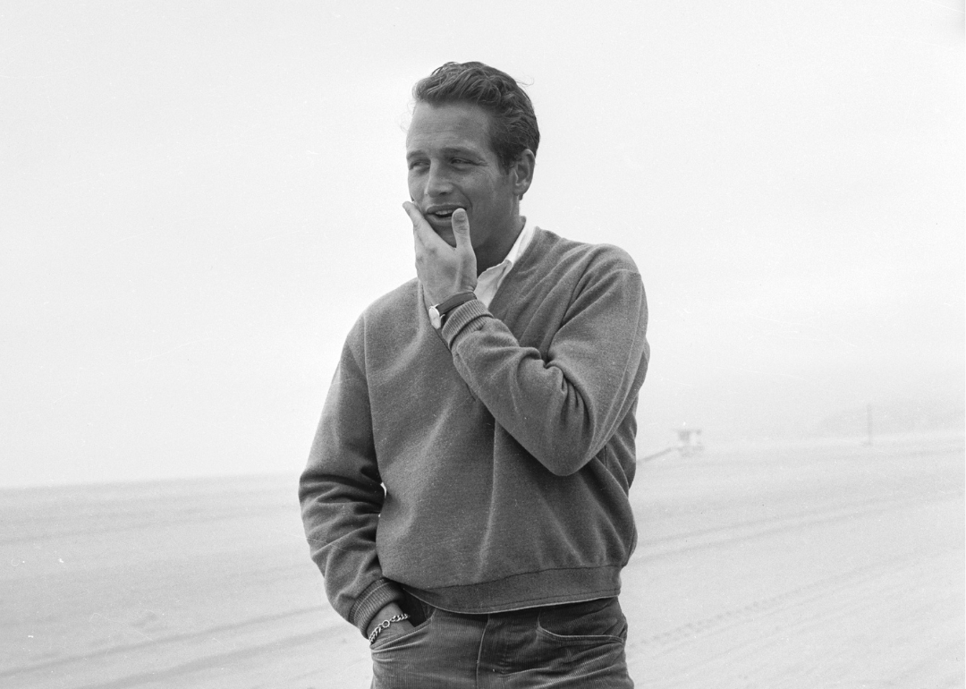 Candid portrait of Paul Newman on a beach
