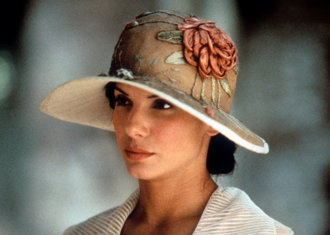 Actor Sandra Bullock wearing a flowered floppy hat in a scene from the 1996 film 'In Love And War.'