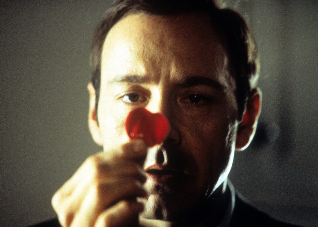 Kevin Spacey staring at a rose pedal in a scene from the 1999 film 'American Beauty.' 