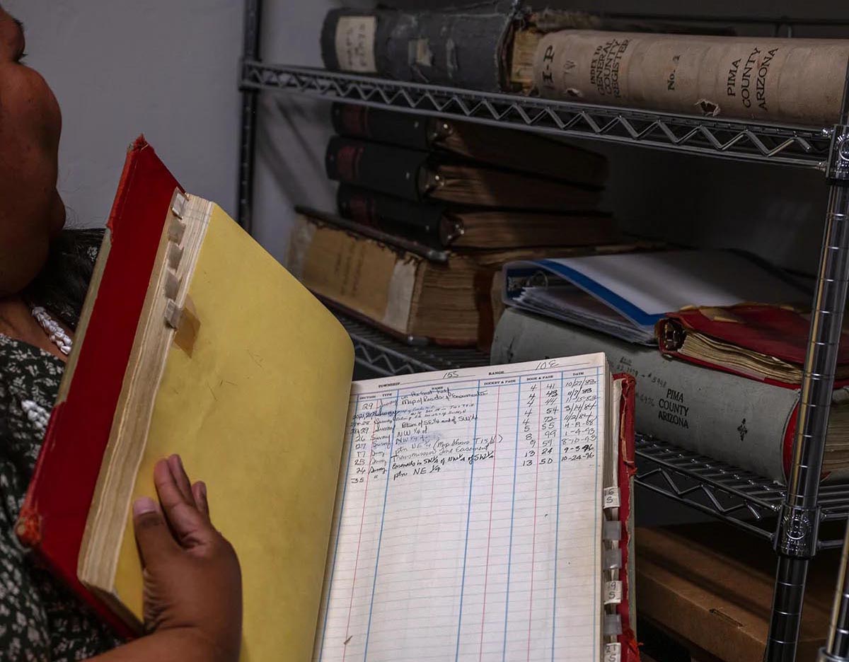 Gabriella Cázares-Kelly goes through old Pima County records at her offices in Tucson, Arizona. 