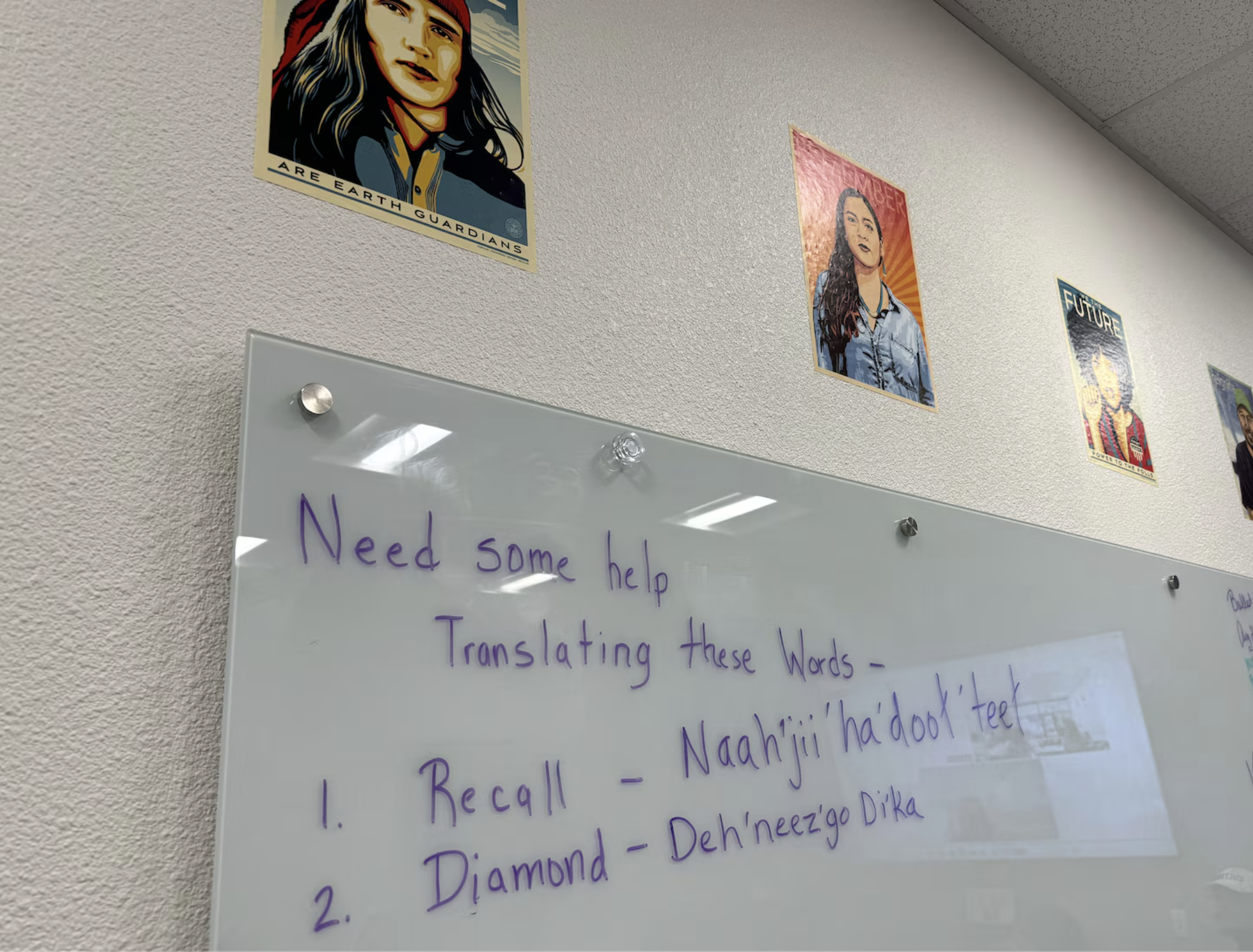 A whiteboard in the Coconino County Elections Center showing words that need translating.