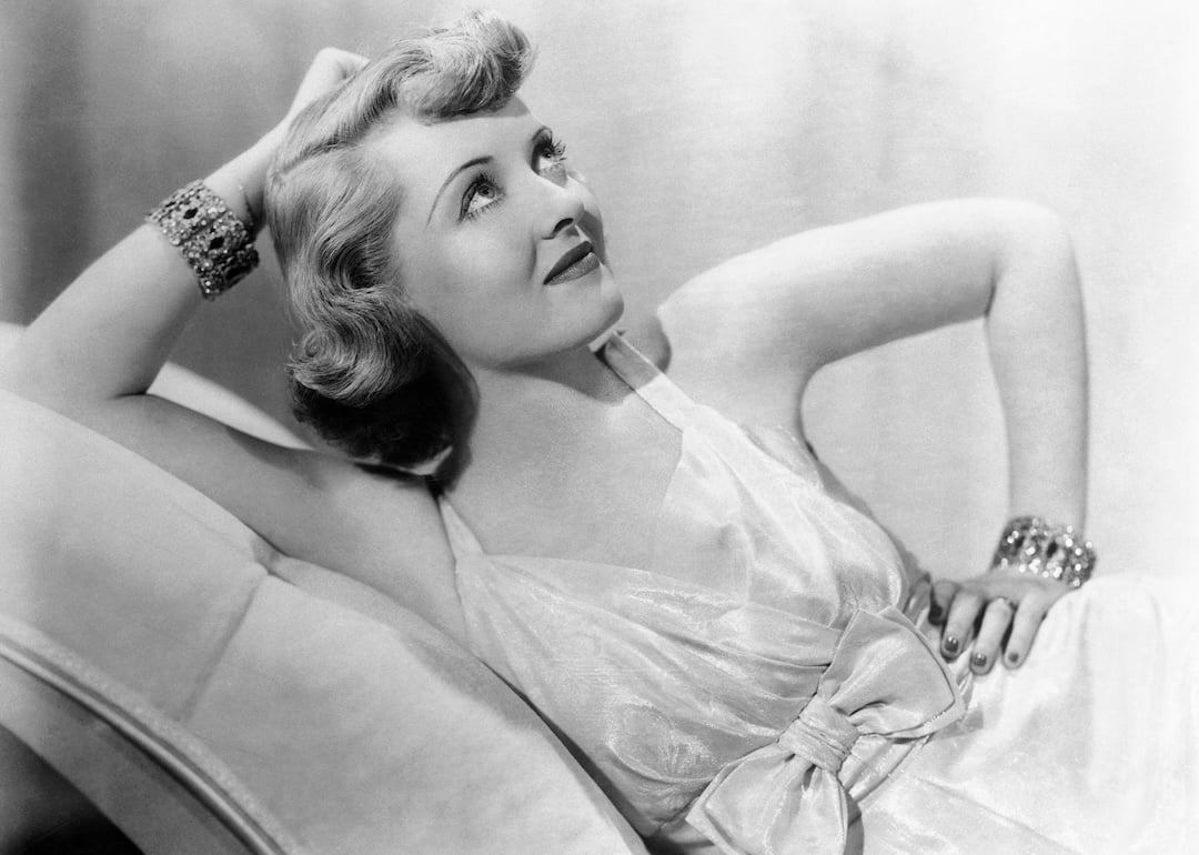 Portrait of Bette Davis lounging.