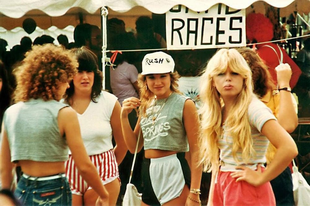 Four young women hanging out at a festival