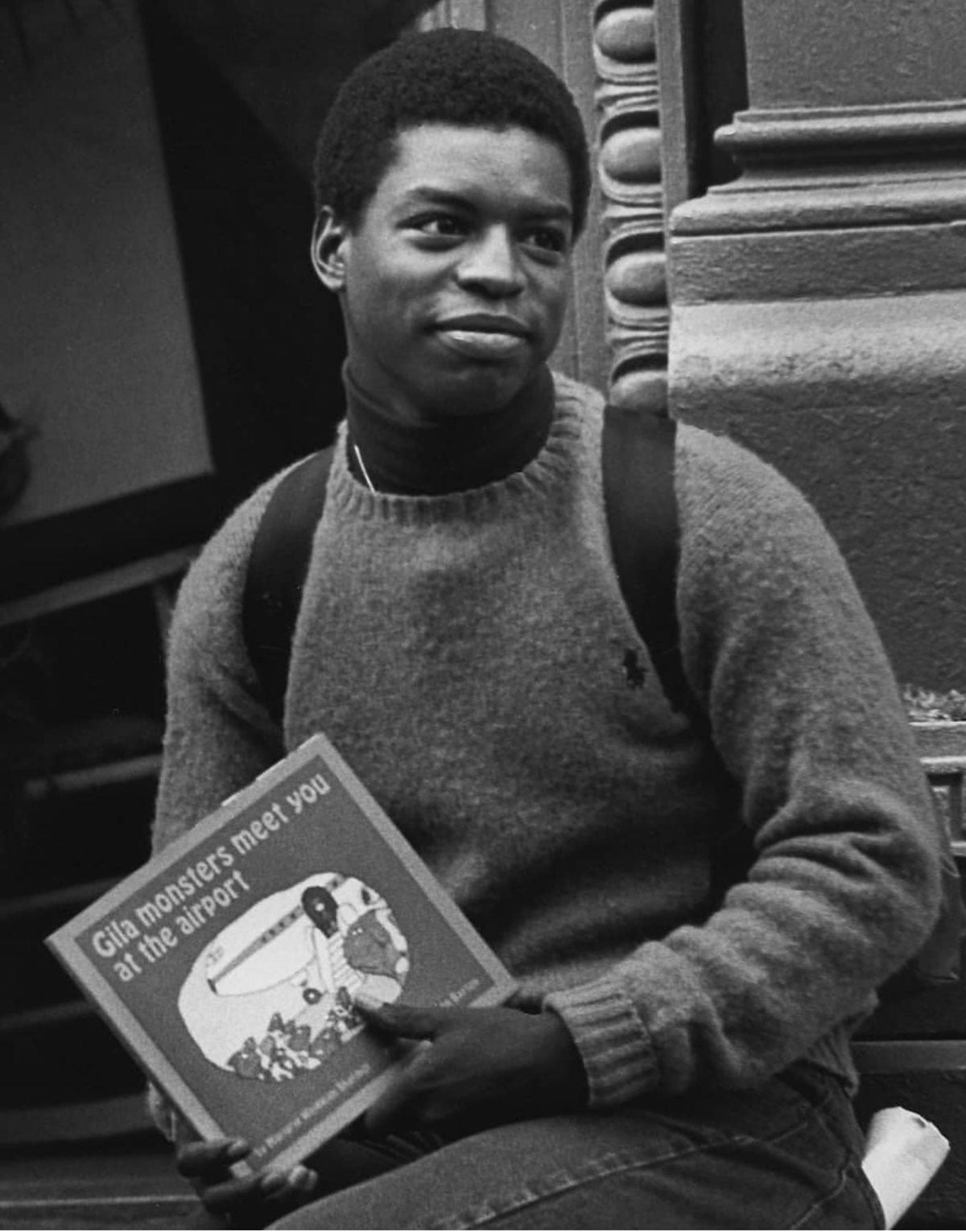 Black and white photo of LaVar Burton holding a book titled "Gila monsters meet you at the airport"