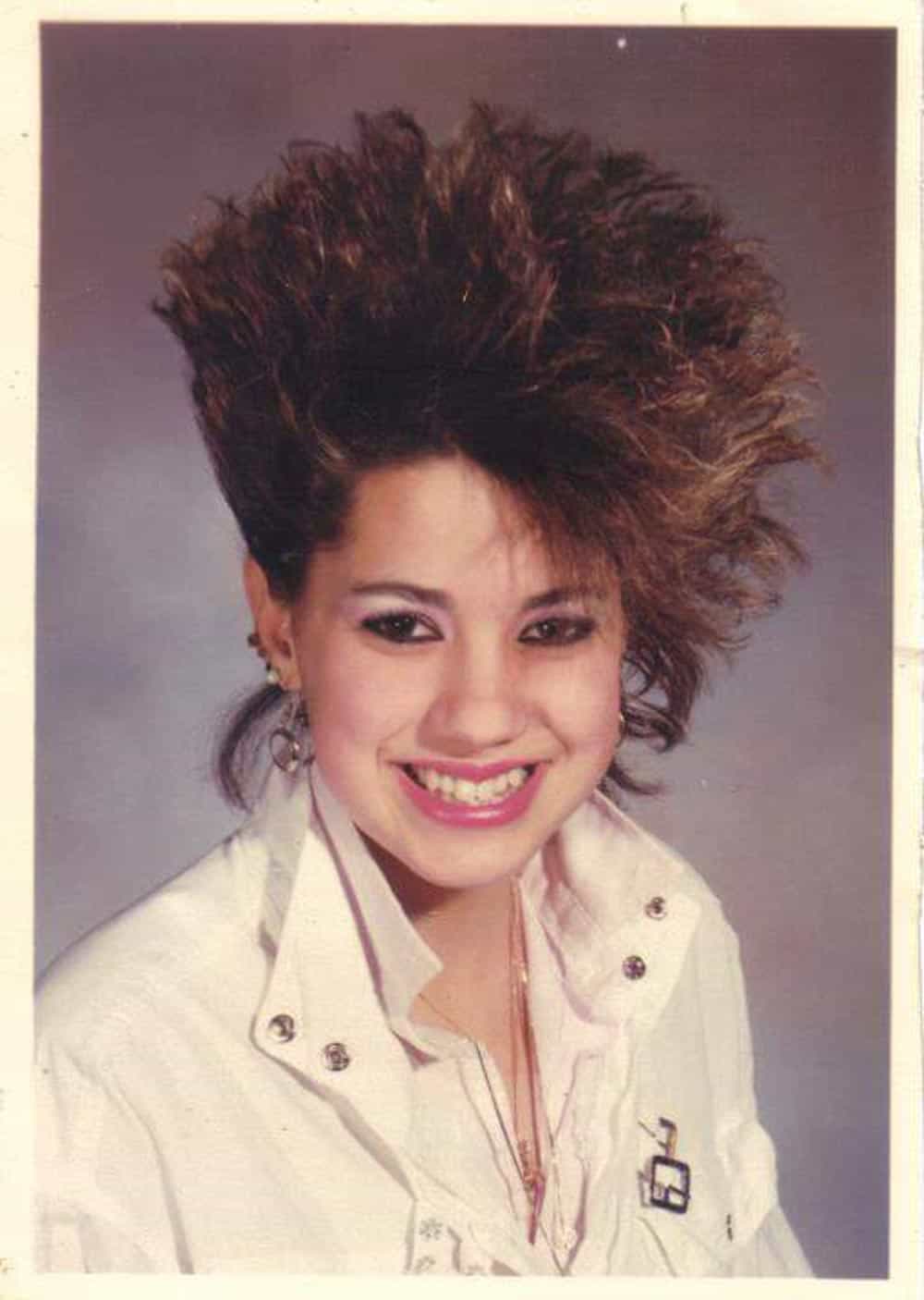 Class photo of a girl with incredible 1980s hair