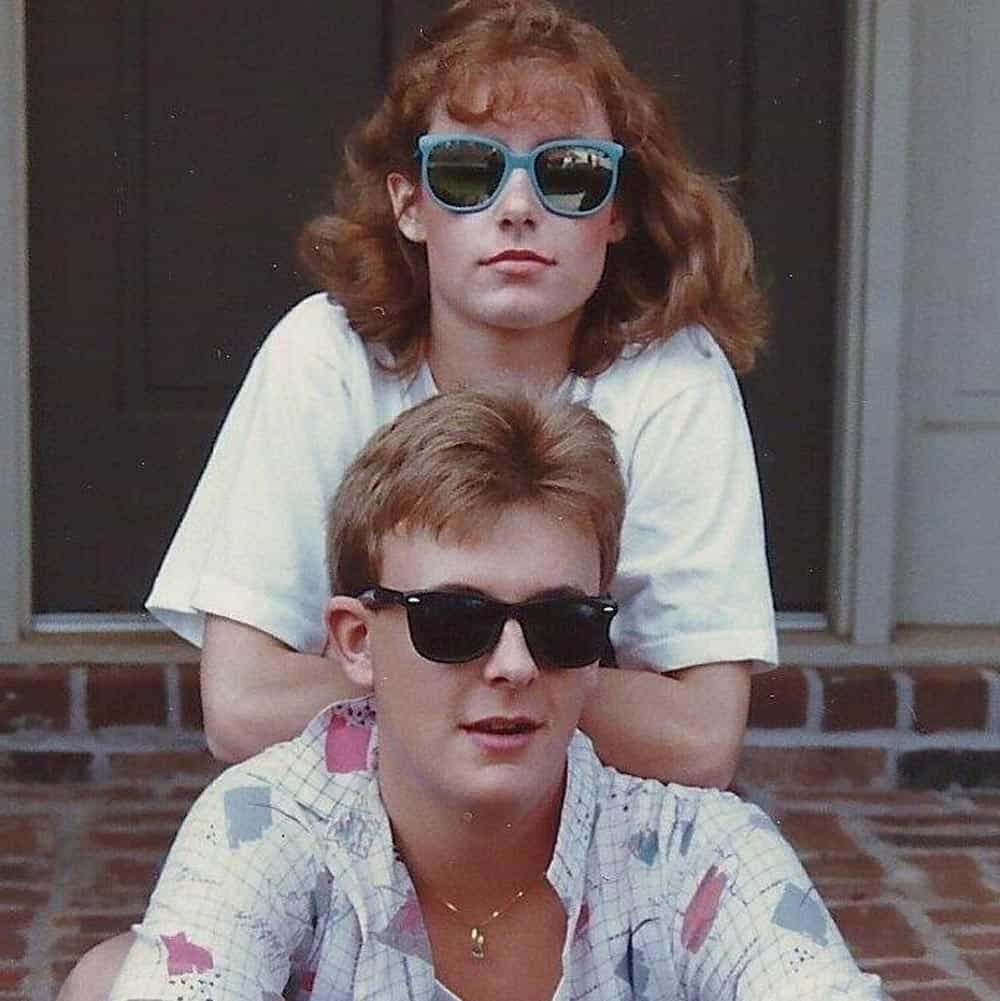 A guy and and gal wearing sunglasses
