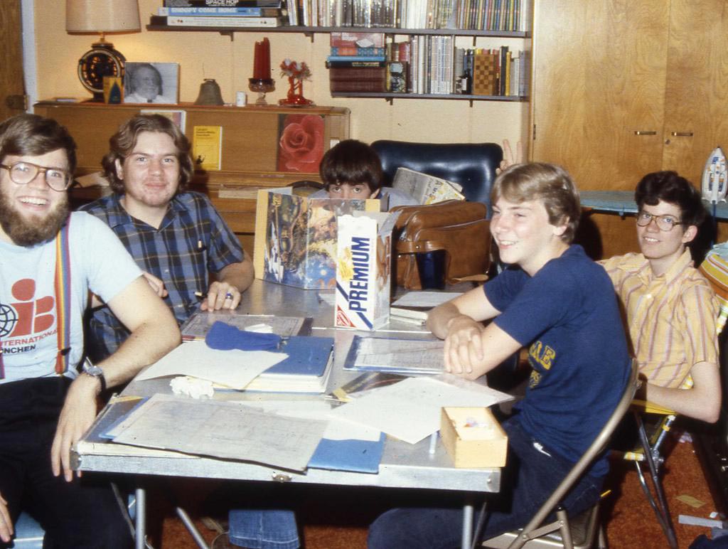 5 guys sitting around a table playing Dungeons and Dragons