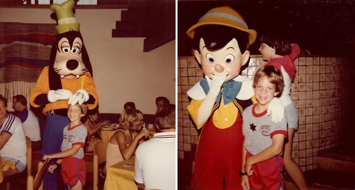 A kid at Disney World with Goofy and Pinocchio