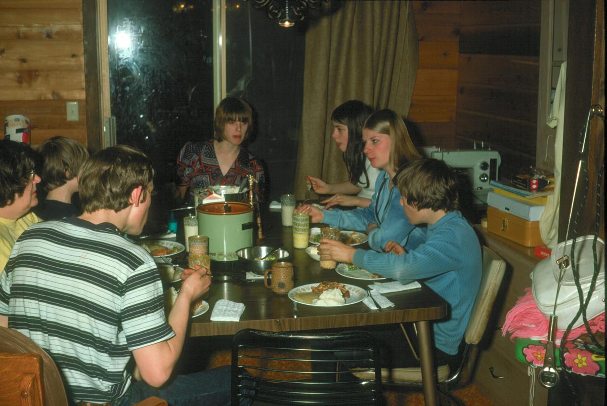 A family sitting around a dinner table eating