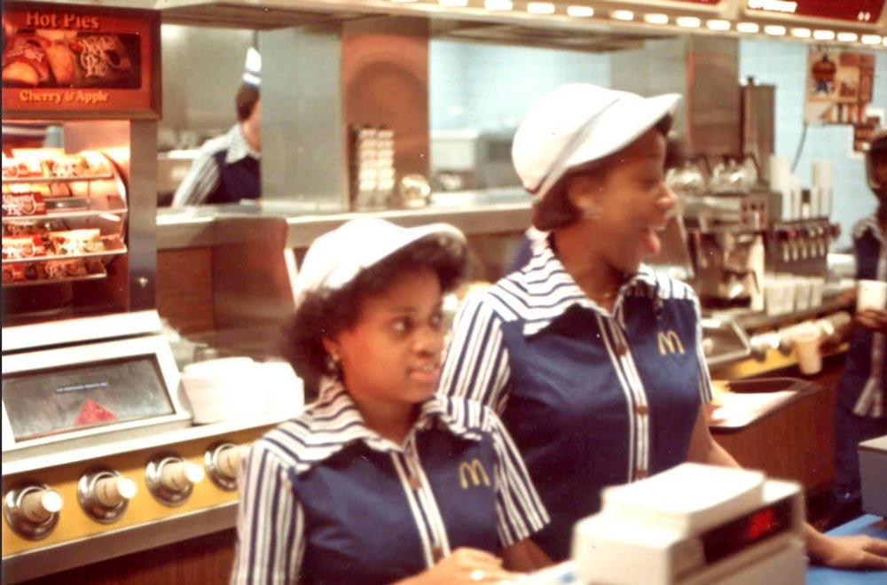 Two woman behind the register at a McDonald's in the 1980s