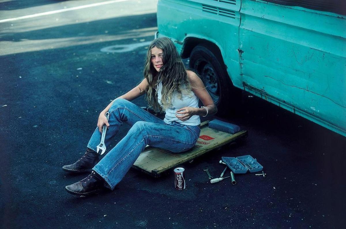 A woman working on her VW van