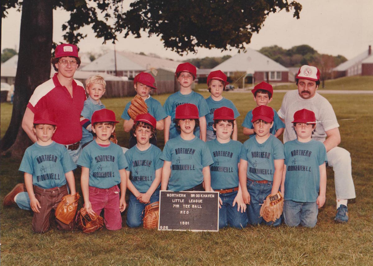 A group of kids and coaches posing for a team photo