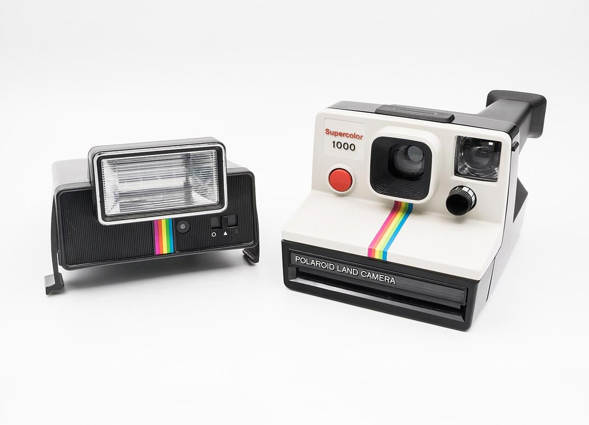 A Polaroid Land Camera, also known as the OneStep with flash