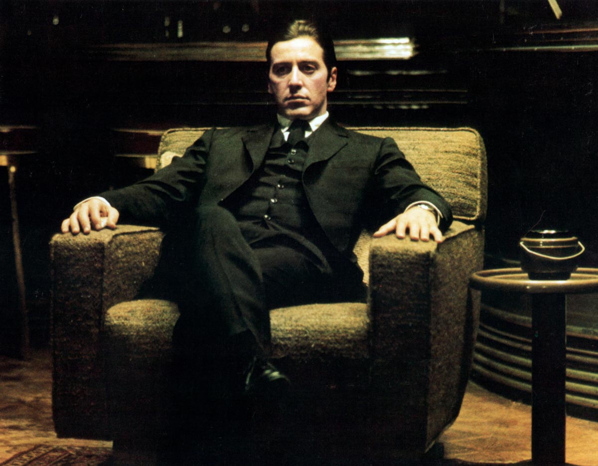 Al Pacino sits in a chair in a scene from the film 'The Godfather: Part II', 1974. 