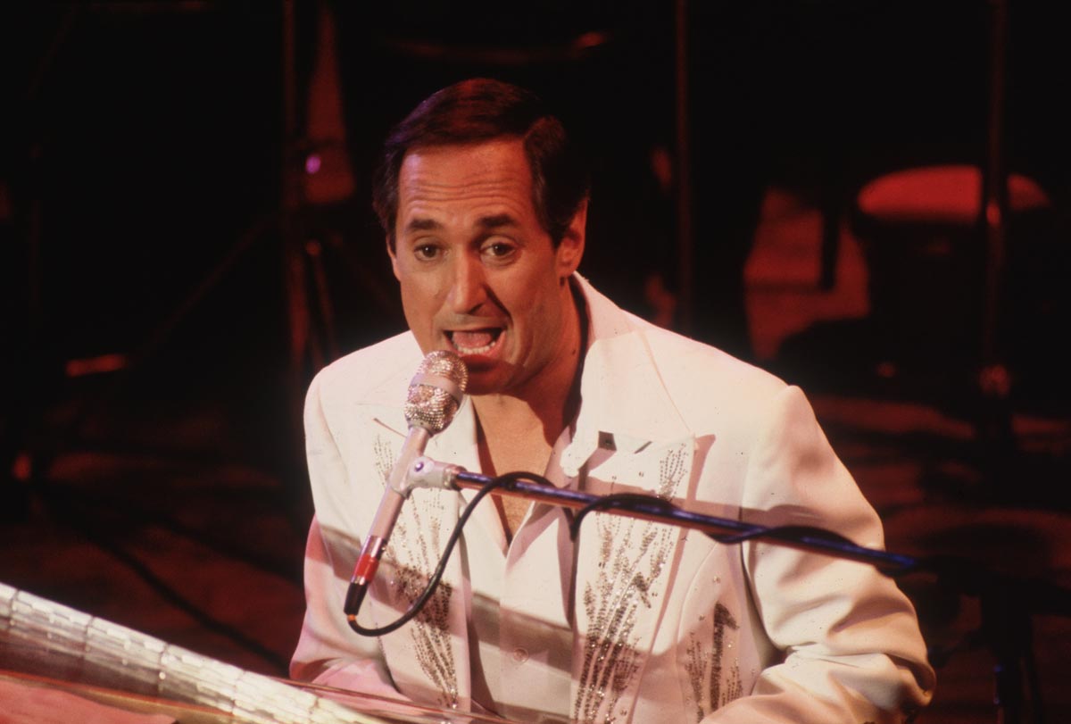 American songwriter, pianist and singer Neil Sedaka on stage at the Colston Hall in Bristol in 1975.