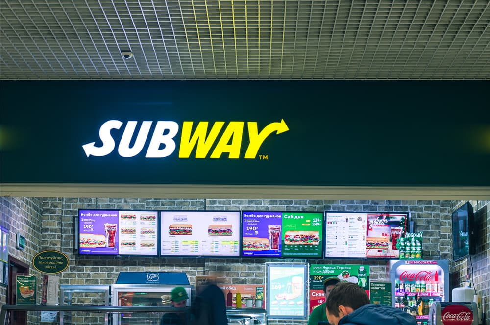 People stands in the Subway fast food restaurant