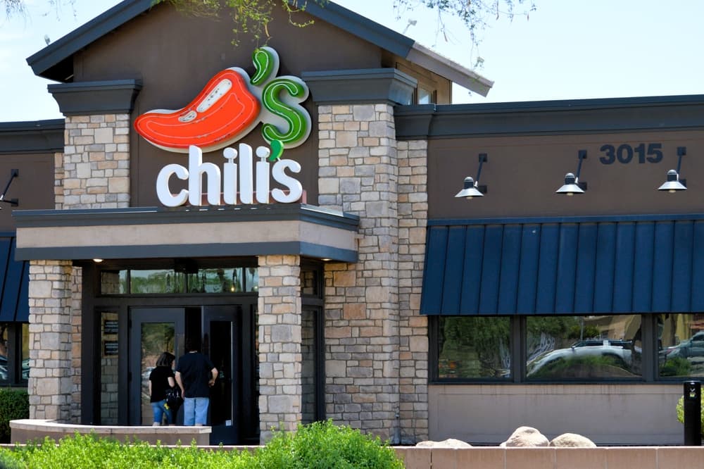Customers entering a Chili's Grill and  Bar,  an American casual dining restaurant chain.