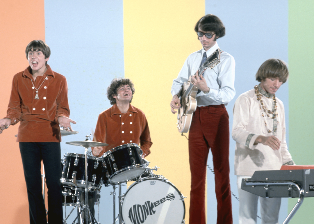 The Monkees in a portrait session with instruments.