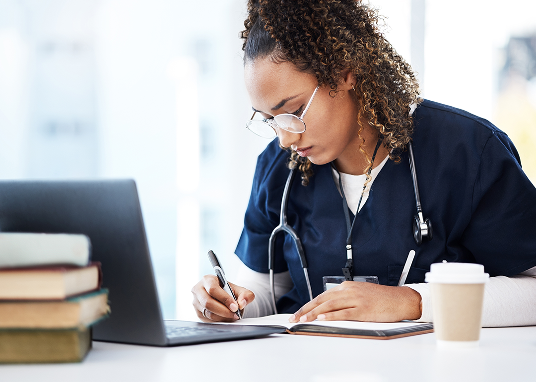 Nursing student taking notes.