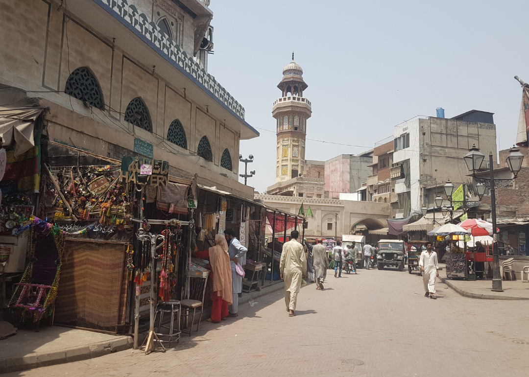 People walking through the Chitta Gate in the old town area of Lahore