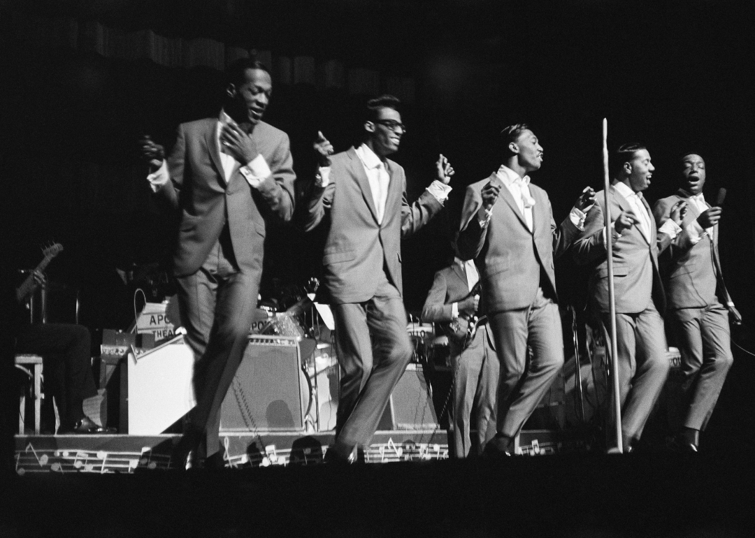 The Temptations perform onstage at the Apollo Theater.