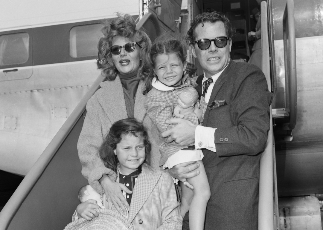 Rita Hayworth and singer Dick Haymes pose with Rita's two daughters form previous marriages.