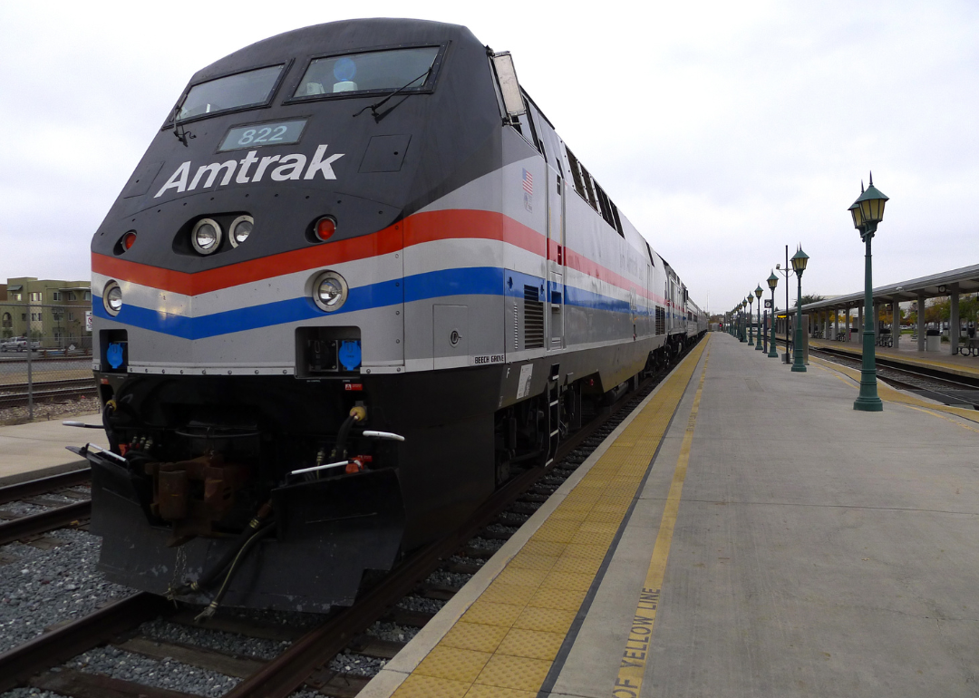 An Amtrak train pulling up to a station in Bakersfield, California.