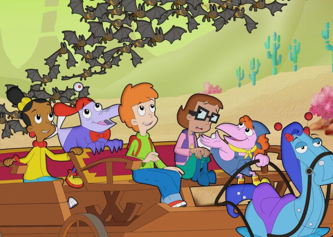 A still from Cyberchase with the characters looking at a swarm of bats above them. 