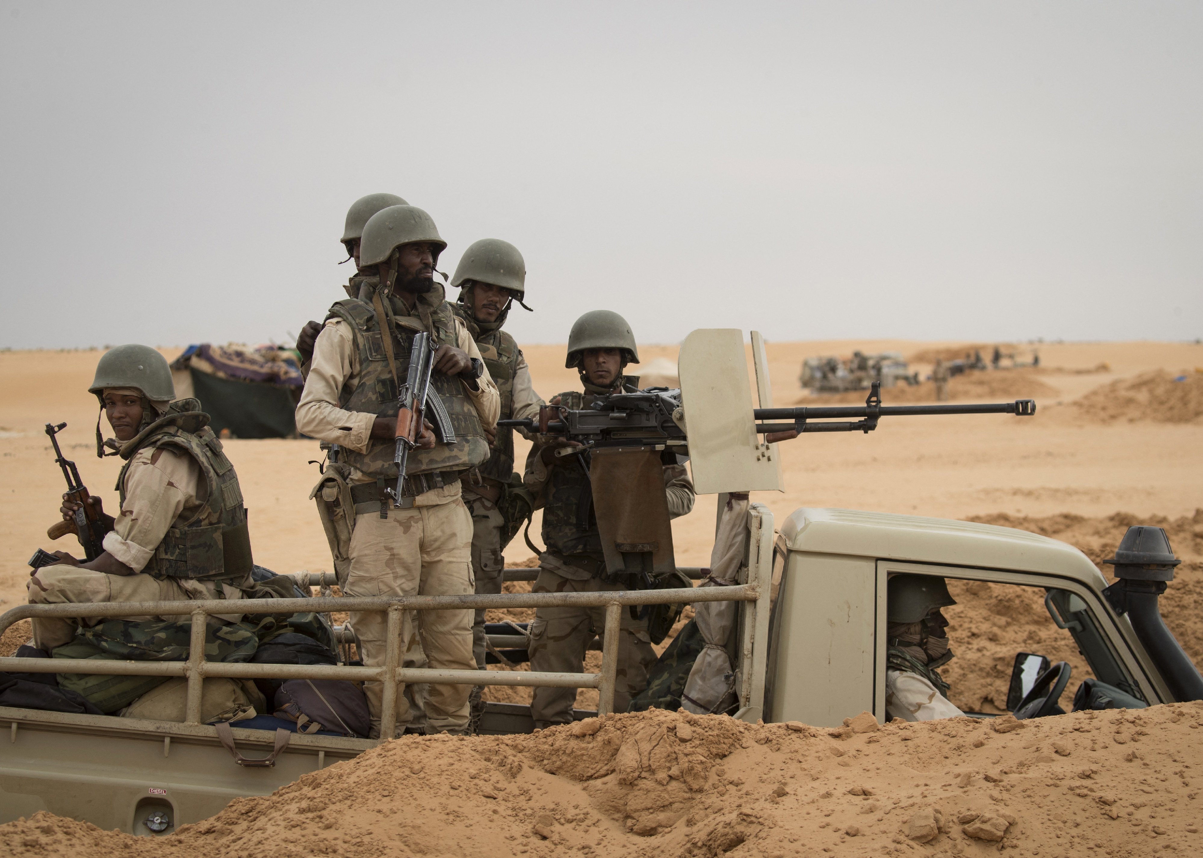 Soldiers of the Mauritania Army wait in an armed vehicle at a G5 Sahel task force outpost.
