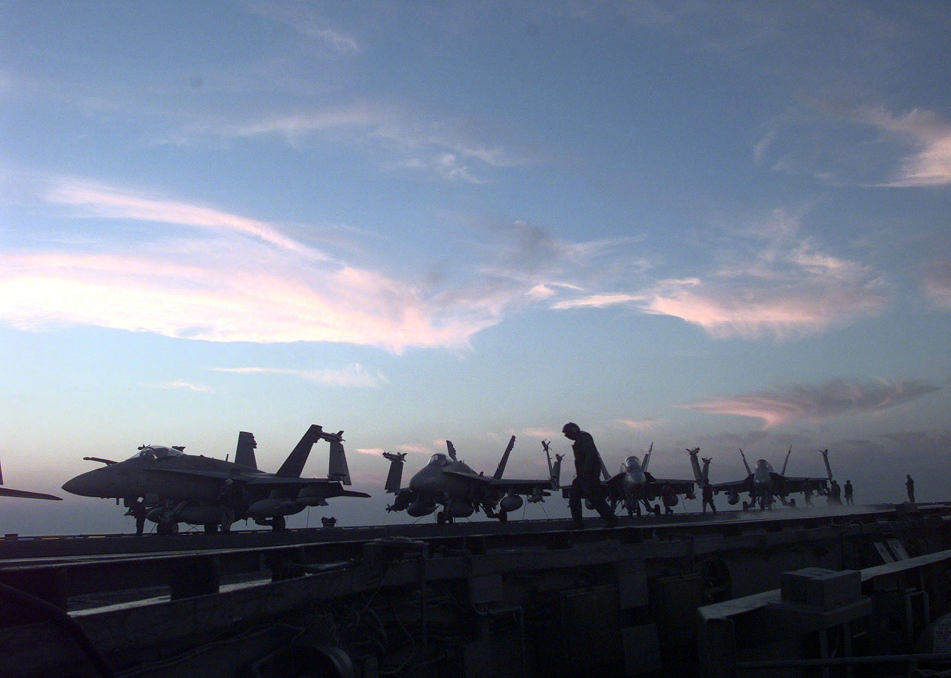 Sailors on the USS Enterprise prepare the flightdeck for flight operations during Operation Desert Fox.