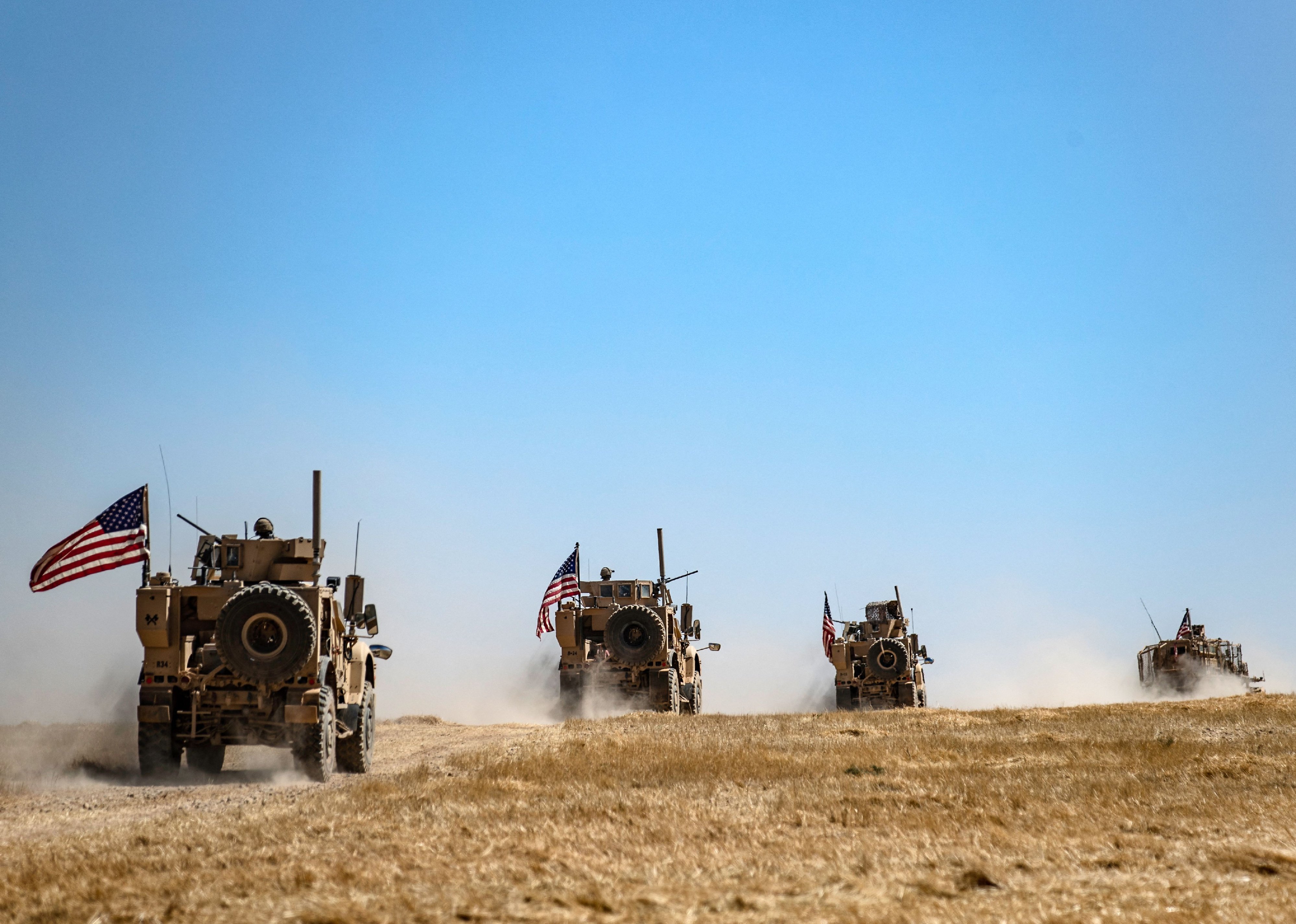 A US military convoy takes part in joint patrol in the Syrian village of al-Hashisha.