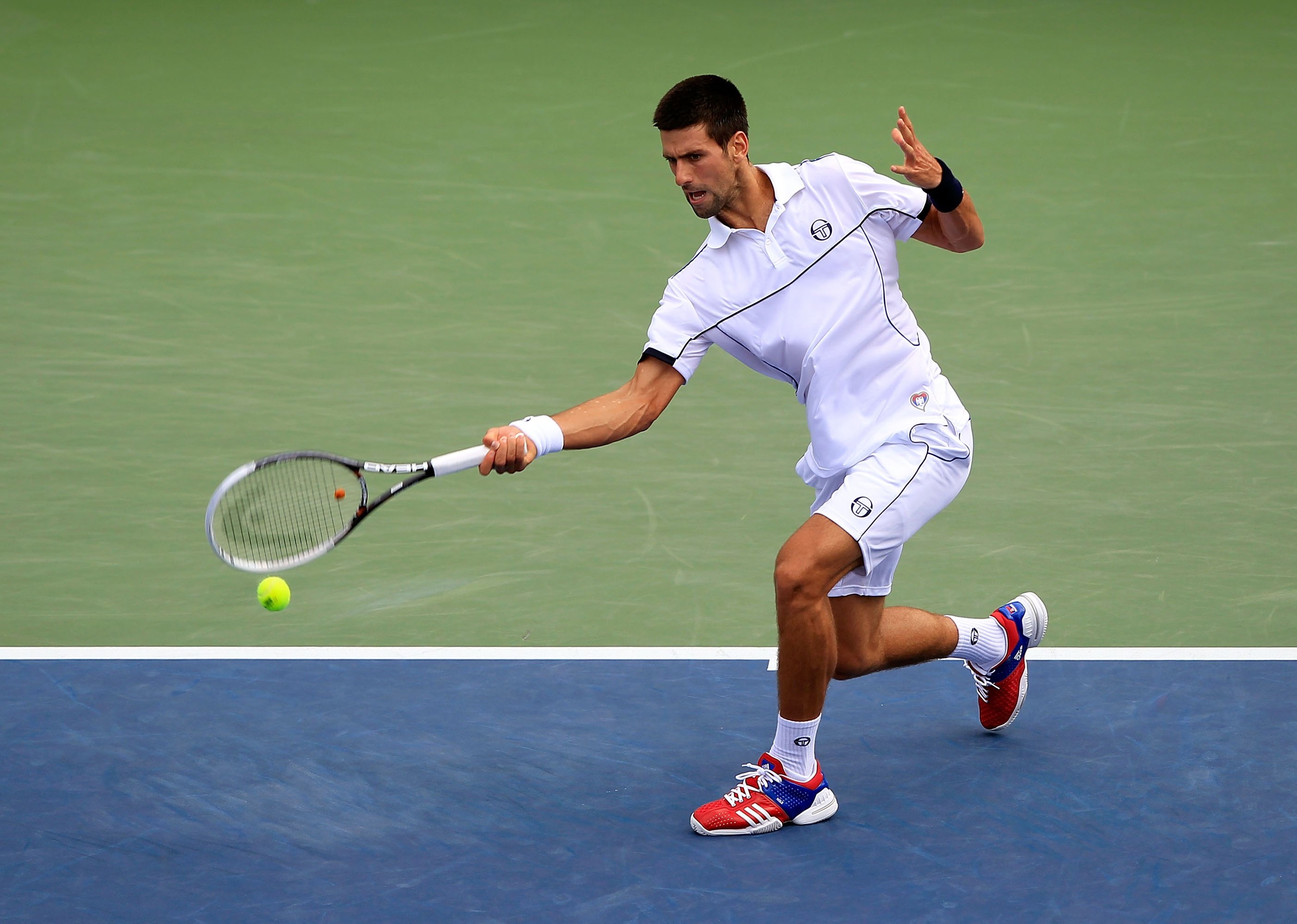 Novak Djokovic returns a shot during the 2011 U.S. Open.