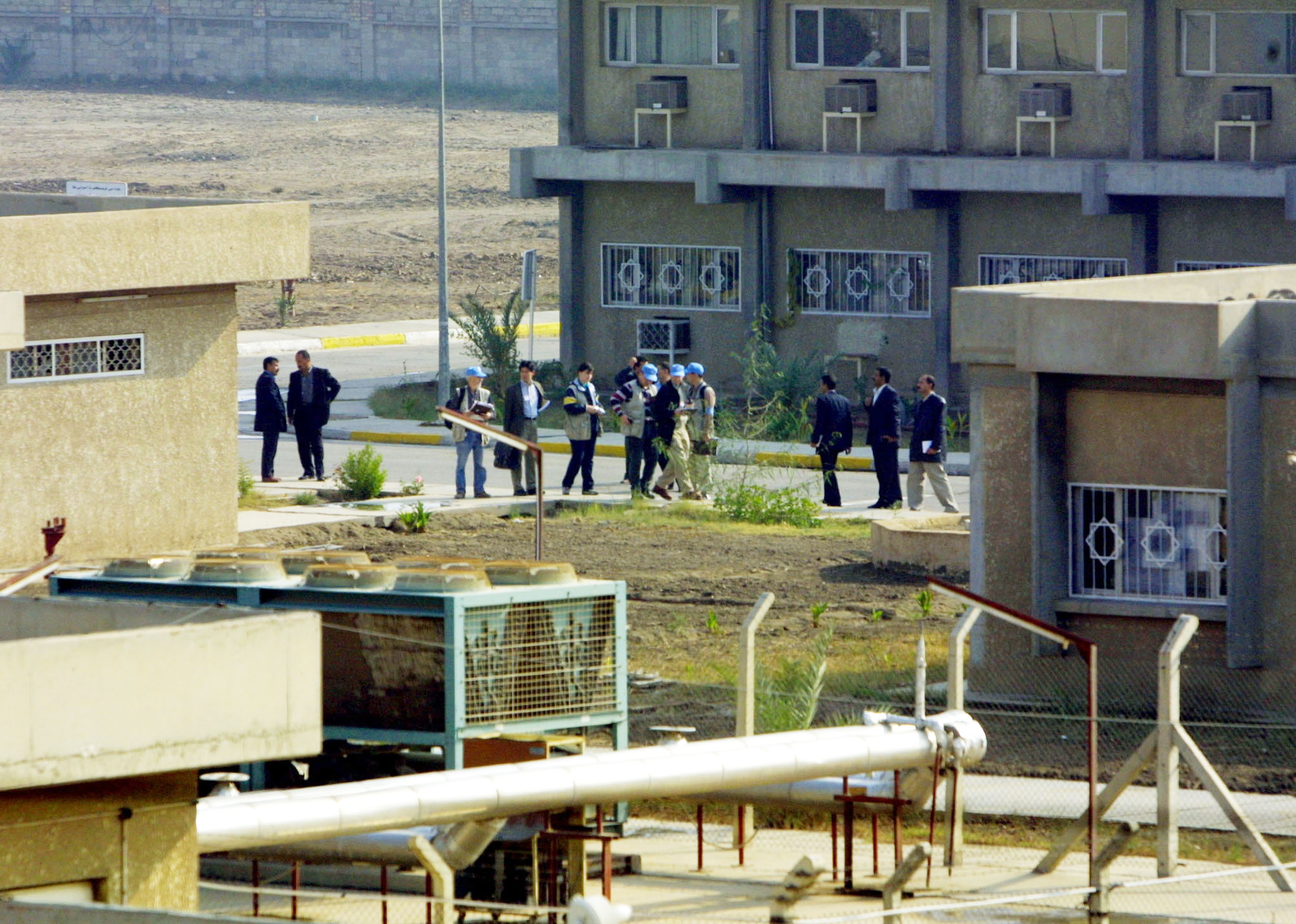  A U.N. inspection team conducts a search for weapons in December 2002 in Baghdad. 