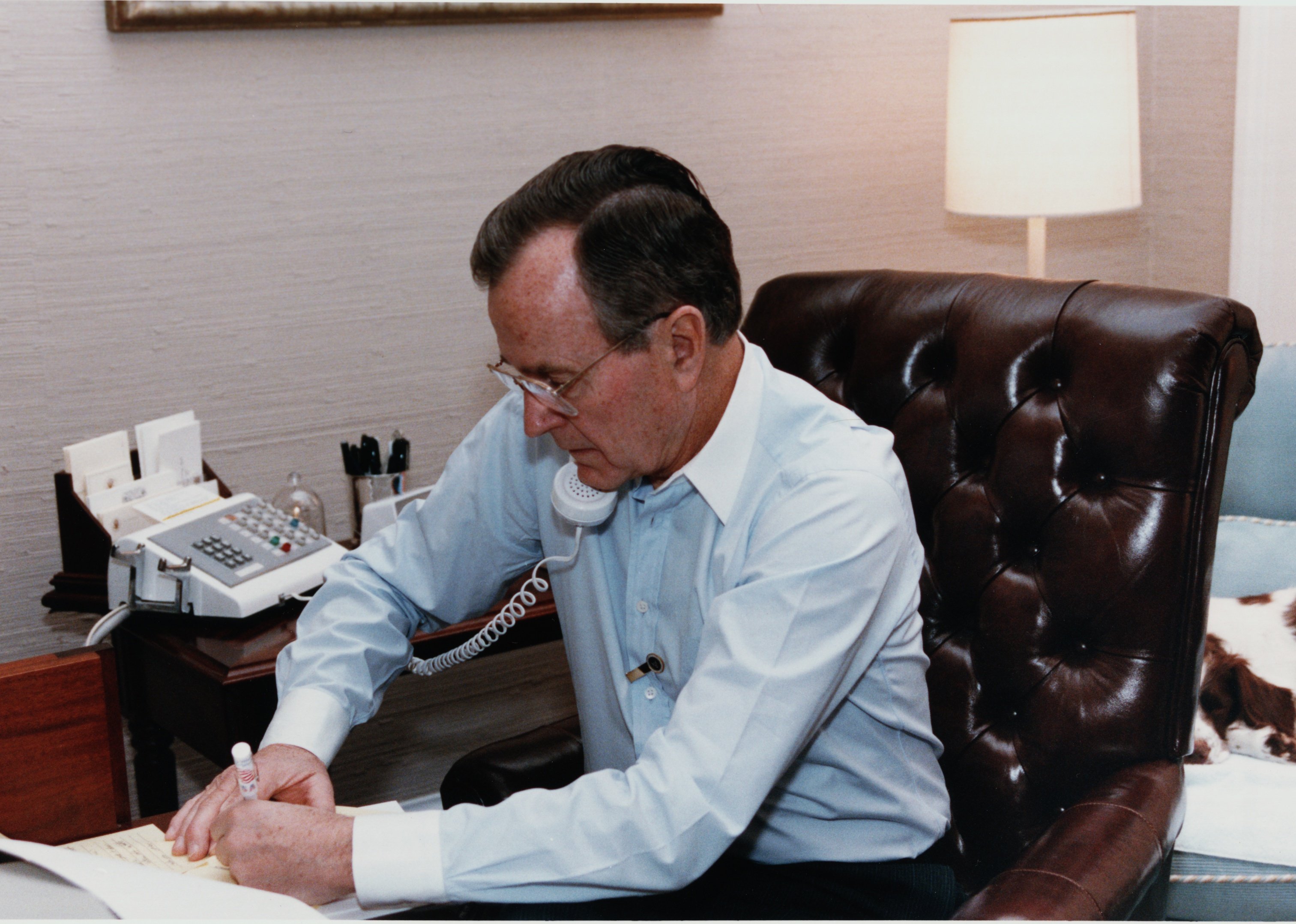President Bush on the phone with James Baker after the Secretary's first meeting with Tariq Aziz. 