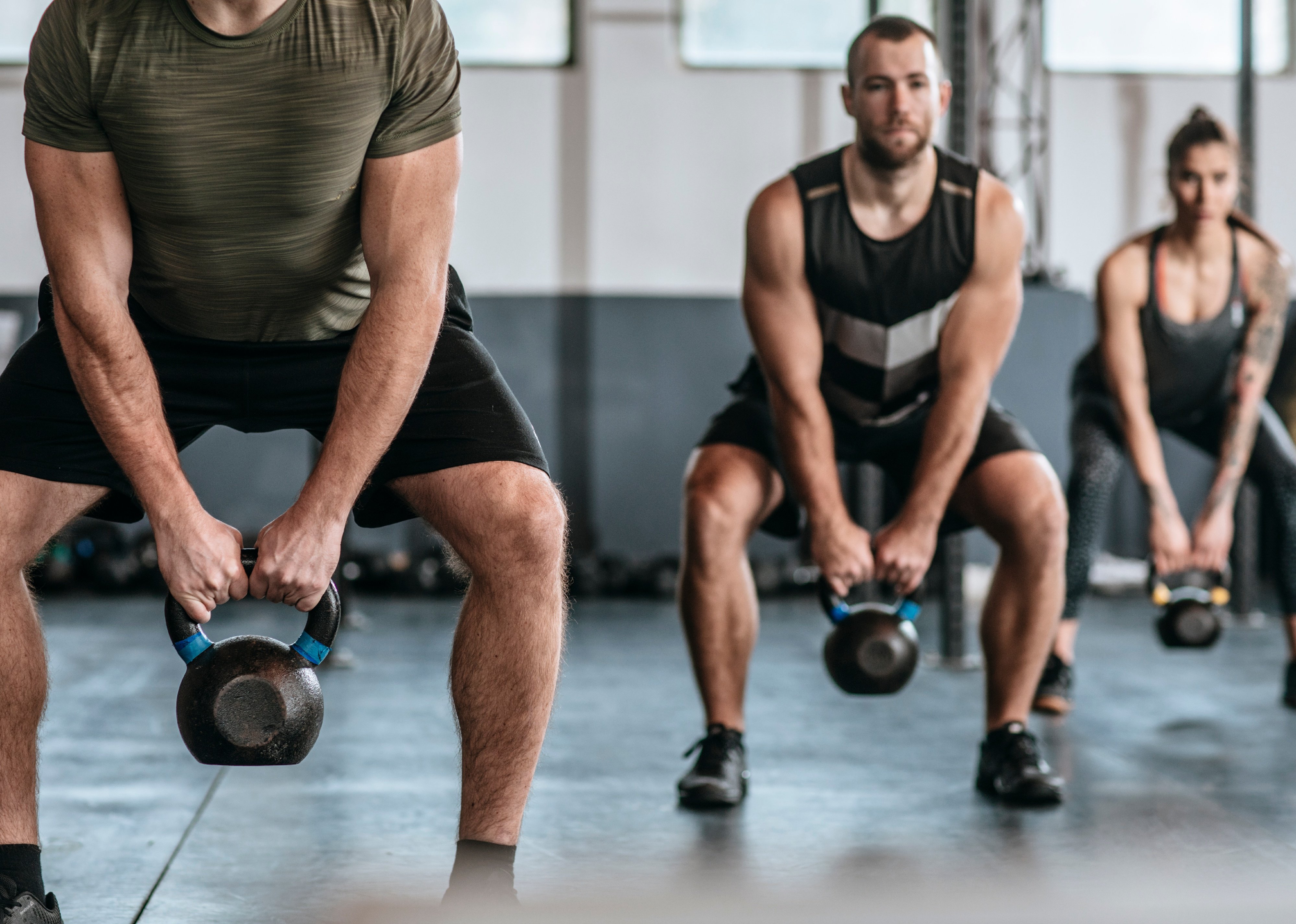 group of men lifting weights