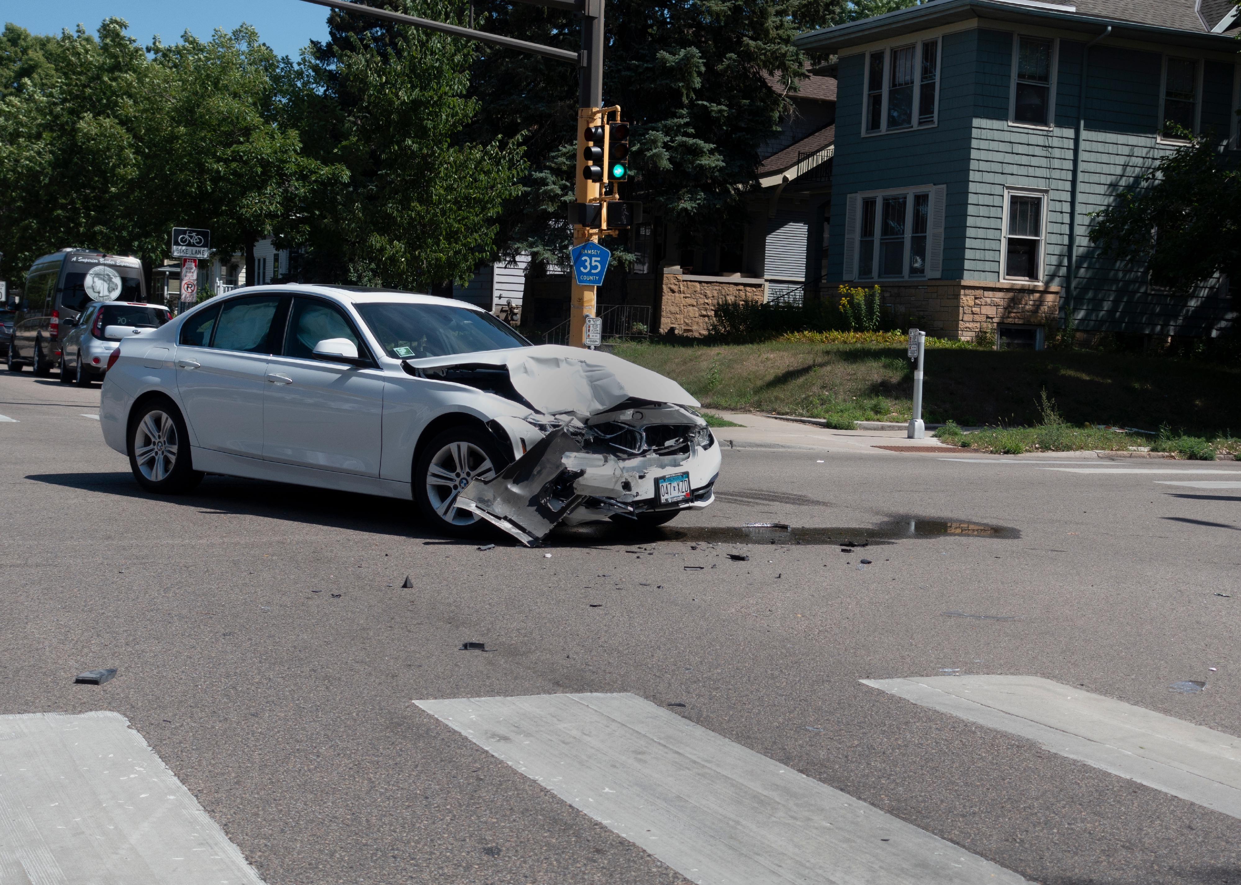 Car damaged in an accident on a city street.