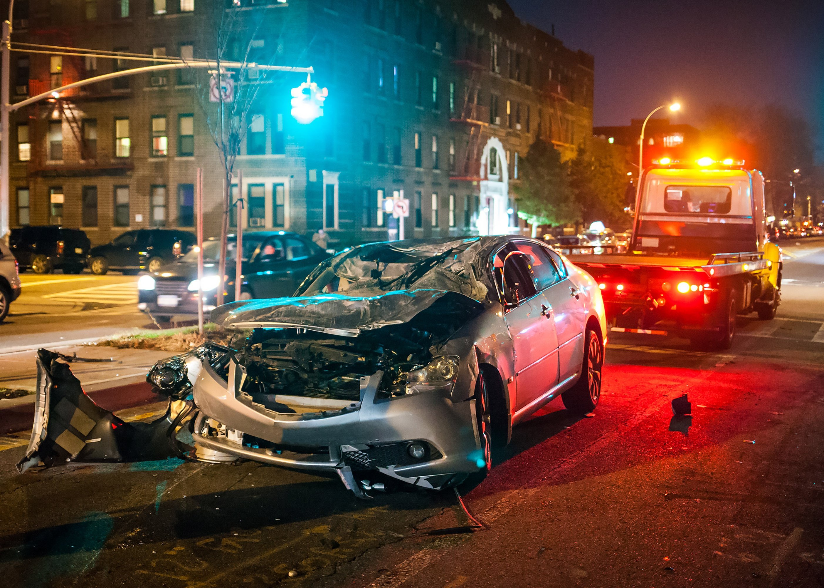 Evening scene of a NYC car crash.