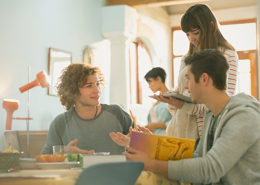 A group of college students having a conversation.