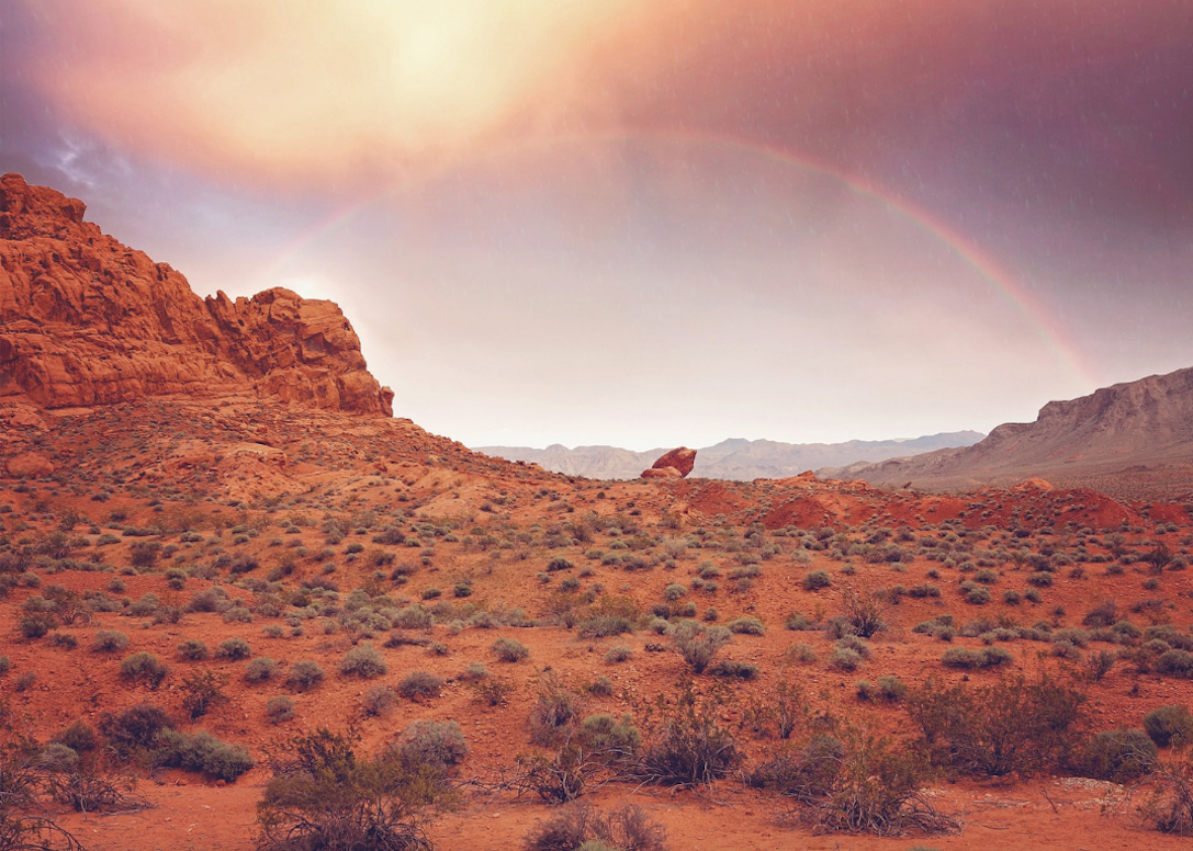 #2. Nevada Red rock formations with a rainbow above